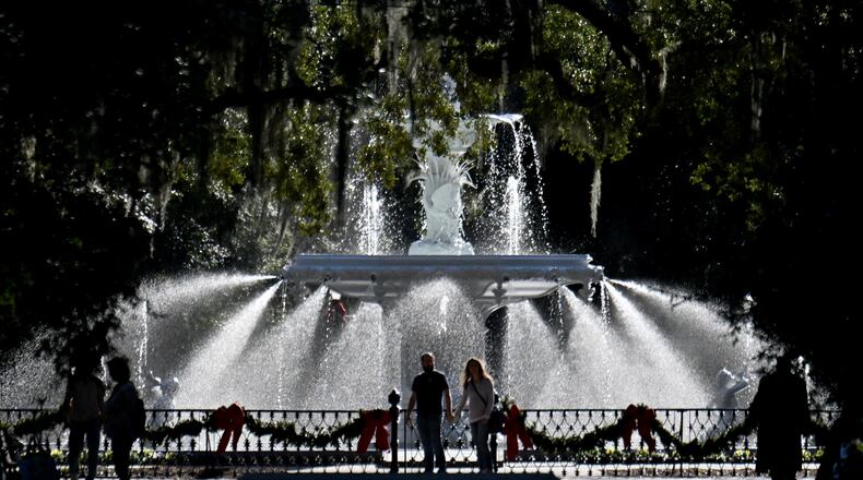 People came to check out The Forsyth Park fountain that returned to operation Friday after a six-month restoration project, Friday, December 19, 2025 in Savannah. The Forsyth Park fountain, a landmark of this historic city since 1858, returned to operation after a six-month restoration that included a full dismantlement and removal of the cast-iron structure. (Hyosub Shin/AJC)