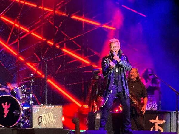 Billy Idol performs "Still Dancing" as his opener during his Ameris Bank Amphitheatre performance Friday in Alpharetta. (Rodney Ho/AJC)