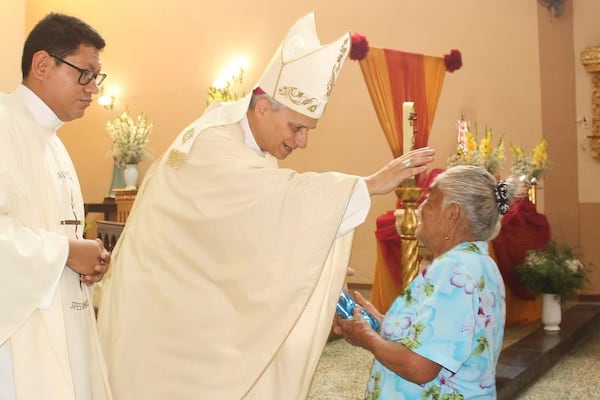 In this photo released by the Cruz de Motupe Brotherhood, Bishop Robert Prevost, who was elected Pope Leo XIV on May 8, 2025, blesses a woman during a Mass in Motupe, Peru, in September 2020. (Cruz de Motupe Brotherhood via AP)