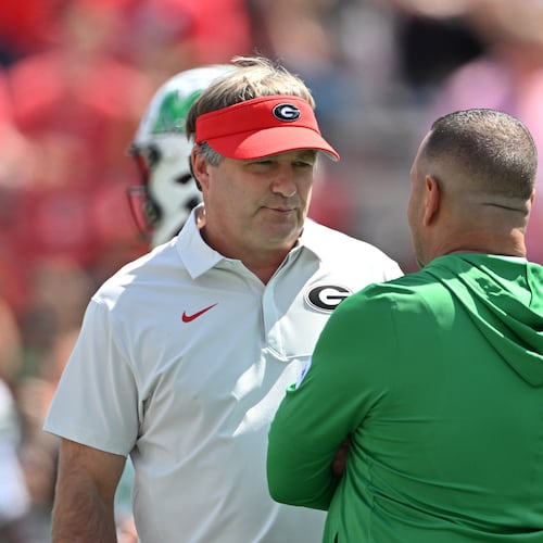Georgia head coach Kirby Smart (left) speaks with Marshall head coach Tony Gibson at Sanford Stadium on Saturday, Aug. 30, 2025, in Athens. Smart was not happy with the level of competition Marshall provided in last season’s opening game. (Hyosub Shin/AJC)