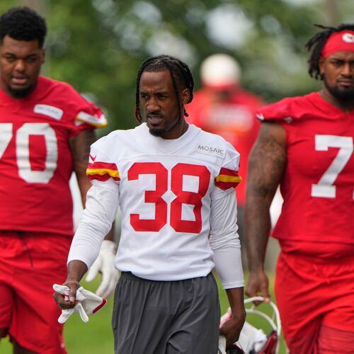 Kansas City Chiefs tackle Kahil Benson (70), cornerback L'Jarius Sneed (38) and tackle Josh Simmons (71) arrive at NFL football training camp Wednesday, July 29, 2026, in St. Joseph, Mo. (AP Photo/Charlie Riedel)