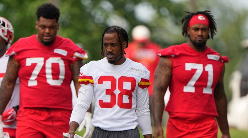 Kansas City Chiefs tackle Kahil Benson (70), cornerback L'Jarius Sneed (38) and tackle Josh Simmons (71) arrive at NFL football training camp Wednesday, July 29, 2026, in St. Joseph, Mo. (AP Photo/Charlie Riedel)