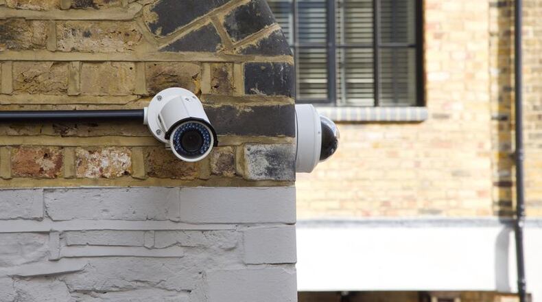 Milton residents and businesses are being asked to voluntarily register their security cameras with police, so they could potentially be called upon to help with criminal investigations. AJC FILE