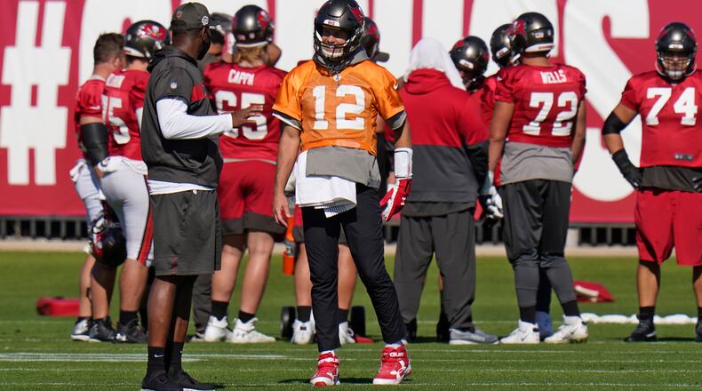 Tampa Bay Buccaneers quarterback Tom Brady (12) talks to offensive coordinator Byron Leftwich during practice Wednesday, Jan. 6, 2021, in Tampa, Fla.(Chris O'Meara/AP)