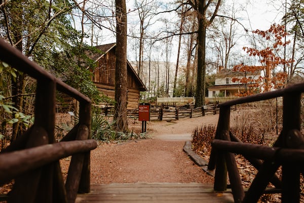 The Tullie Smith farm house, which had been built in 1845 and originally sat on an 800-acre farm in DeKalb County, was moved to the Atlanta Historical Society grounds in 1969. It was listed on the National Register of Historic Places in November 1970. (Courtesy of the Atlanta History Center)