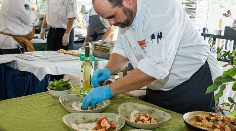 Andrew Smith cooking at the Jekly Island Shrimp and Grits Festival.