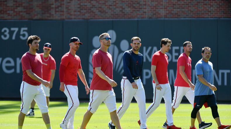 Braves pitchers walk on the field during a workout ahead of the National League Championship Series against the Los Angeles Dodgers at Truist Park on Friday, October 15, 2021. (Hyosub Shin / Hyosub.Shin@ajc.com)