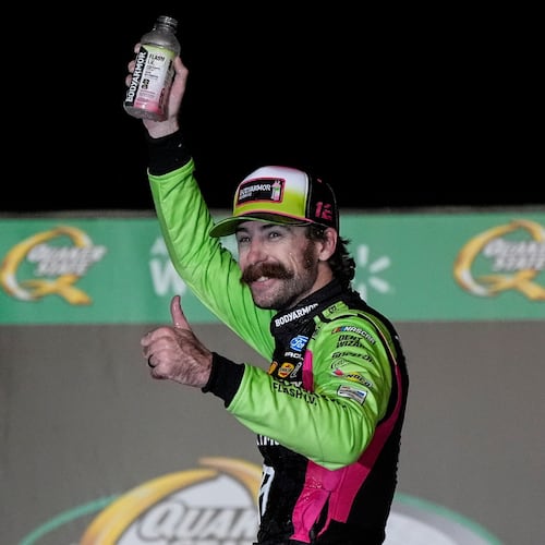 Ryan Blaney celebrates after winning a NASCAR Cup Series auto race, Sunday, July 12, 2026, in Hampton, Ga. (AP Photo/Mike Stewart)