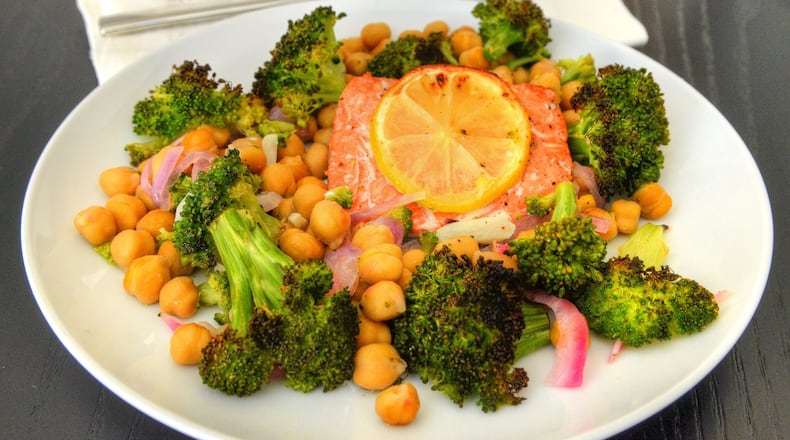 Broccoli, Salmon, Chickpea and Red Onion Sheet-pan Bake can please the whole family, and if salmon isn’t a family favorite, you can use halibut or mahi-mahi instead. STYLING BY JENNIFER ZYMAN / CONTRIBUTED BY CHRIS HUNT PHOTOGRAPHY