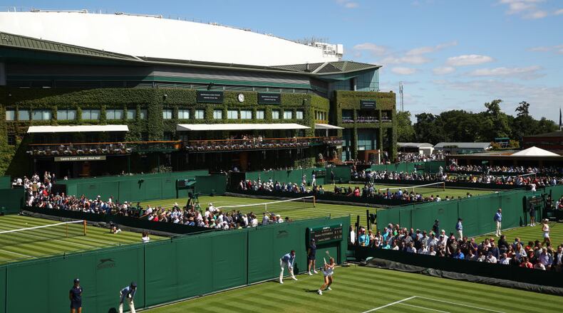 LONDON, ENGLAND - JULY 01: General view of the outside courts with centre court in the background during Day one of The Championships - Wimbledon 2019 at All England Lawn Tennis and Croquet Club on July 01, 2019 in London, England. (Photo by Clive Brunskill/Getty Images)