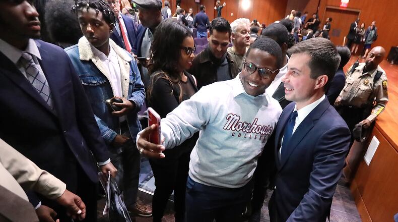 November 18, 2019 Atlanta: Morehouse College student Keron Campbell snaps a selfie with presidential hopeful Pete Buttigieg, Mayor South Bend, Indiana, as he greets students after speaking while launching a new effort to win over black voters during a conversation at Morehouse College on Monday, November 18, 2019, in Atlanta. Curtis Compton/ccompton@ajc.com
