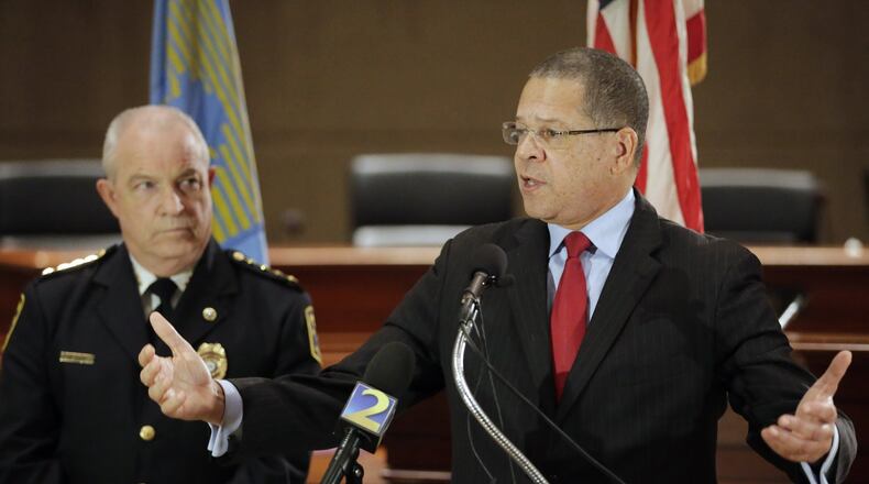 Fulton County Commission Chairman John Eaves (right), standing beside Fulton county police chief Gary Stiles at a press conference, announced proposals to help reduce crime in south Fulton, where there has been an increase this year in car thefts and items stolen from cars. The ideas include a multi-jurisdictional police team to patrol gas stations and grants for increasing surveillance. BOB ANDRES /BANDRES@AJC.COM