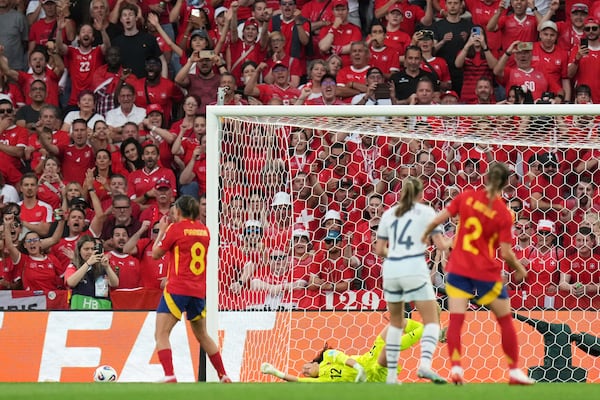 Switzerland fans react after Spain's Mariona Caldentey, left, failed to score a penalty shot during the Women's Euro 2025 quarterfinals soccer match between Spain and Switzerland at Stadion Wankdorf in Bern, Switzerland, Friday, July 18, 2025. (AP Photo/Alessandra Tarantino)