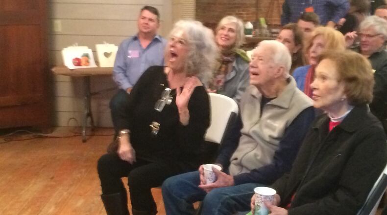 Paula Deen reacts to a comment from painting instructor James Richards Saturday morning in Plains as Rosalynn and Jimmy Carter listen. The morning class was part of “Painting, Paula and a President,” a daylong event in Plains that brought together the TV chef and the former president for a unique fundraiser. Photo by Jill Vejnoska jvejnoska@ajc.com