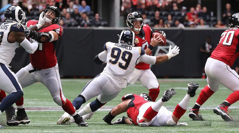 Rams defensive tackle Aaron Donald hits Falcons quarterback Matt Ryan causing a fumble that the Rams recovered and knocking Matt Ryan out of the game with an apparent injury during the fourth quarter Sunday, October 20, 2019, in Atlanta. Curtis Compton/ccompton@ajc.com