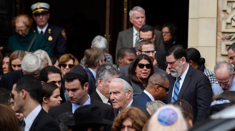 Pittsburgh Mayor Bill Peduto (R) joins mourners outside Rodef Shalom Temple following the funeral of brothers Cecil Rosenthal, 59, and David Rosenthal, 54 on Tuesday in Pittsburgh, Pa. The Rosenthal Brothers were among the 11 victims killed in the mass shooting at the Tree of Life Synagogue on October 27, 2018. Jeff Swensen/Getty Images