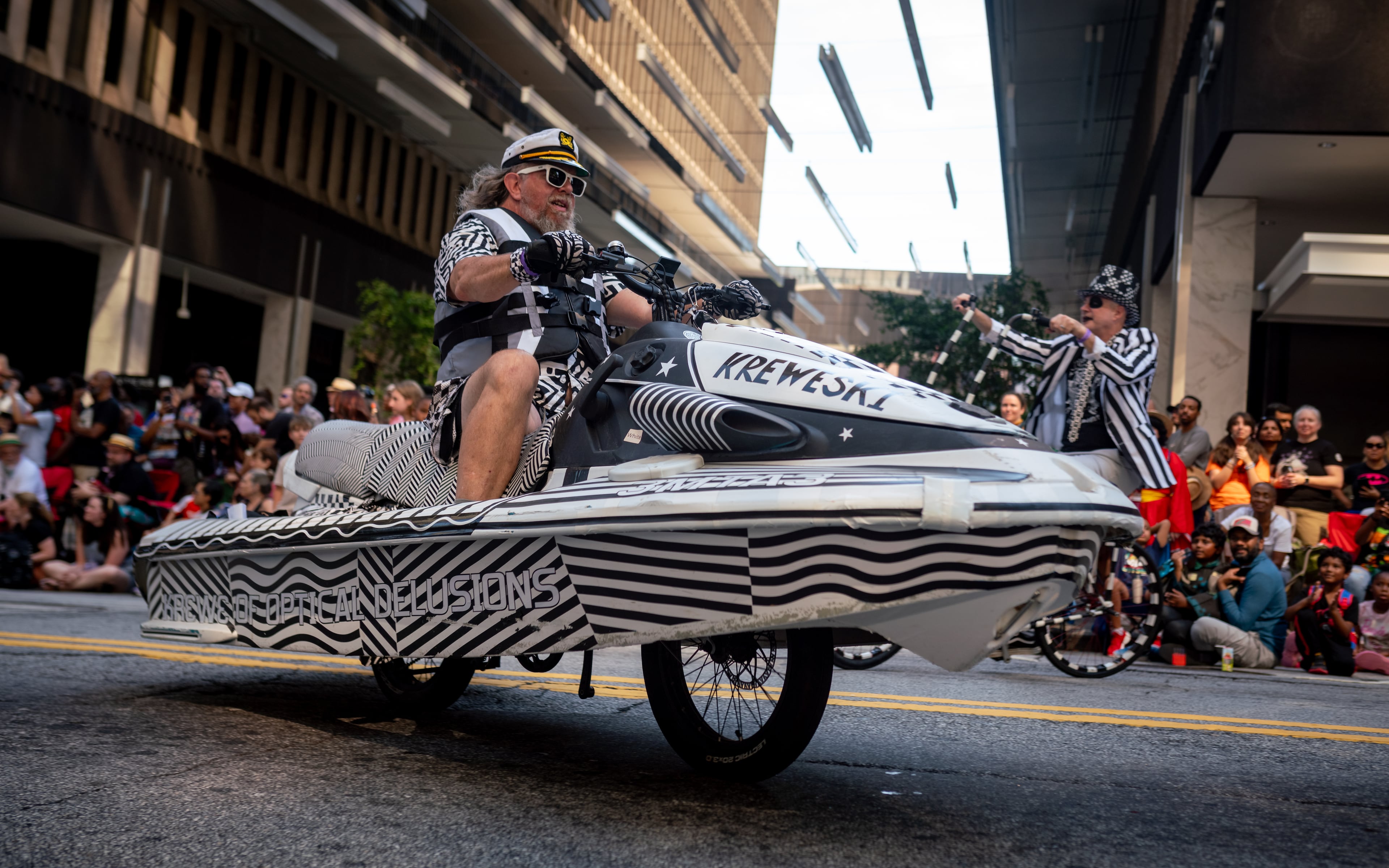 Thousands lined up along Peachtree Street on Saturday morning, August 31, 2024, for the annual Dragon Con parade in Atlanta. (Ben Hendren for The Atlanta Journal-Constitution)