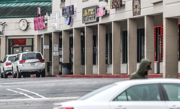 The shooting took place in a shopping center that houses an adult entertainment venue.