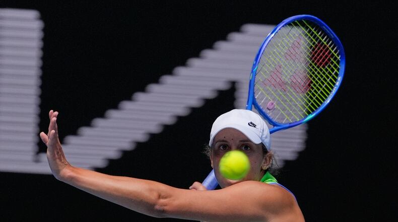 Madison Keys of the U.S. plays a forehand return to compatriot Ashlyn Krueger during their second round match at the Australian Open tennis championship in Melbourne, Australia, Thursday, Jan. 22, 2026. (AP Photo/Asanka Brendon Ratnayake)