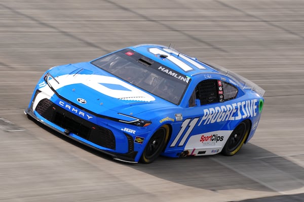 Denny Hamlin drives through Turn 2 during a NASCAR Cup Series auto race at Dover Motor Speedway, Sunday, July 20, 2025, in Dover, Del. (AP Photo/Derik Hamilton)