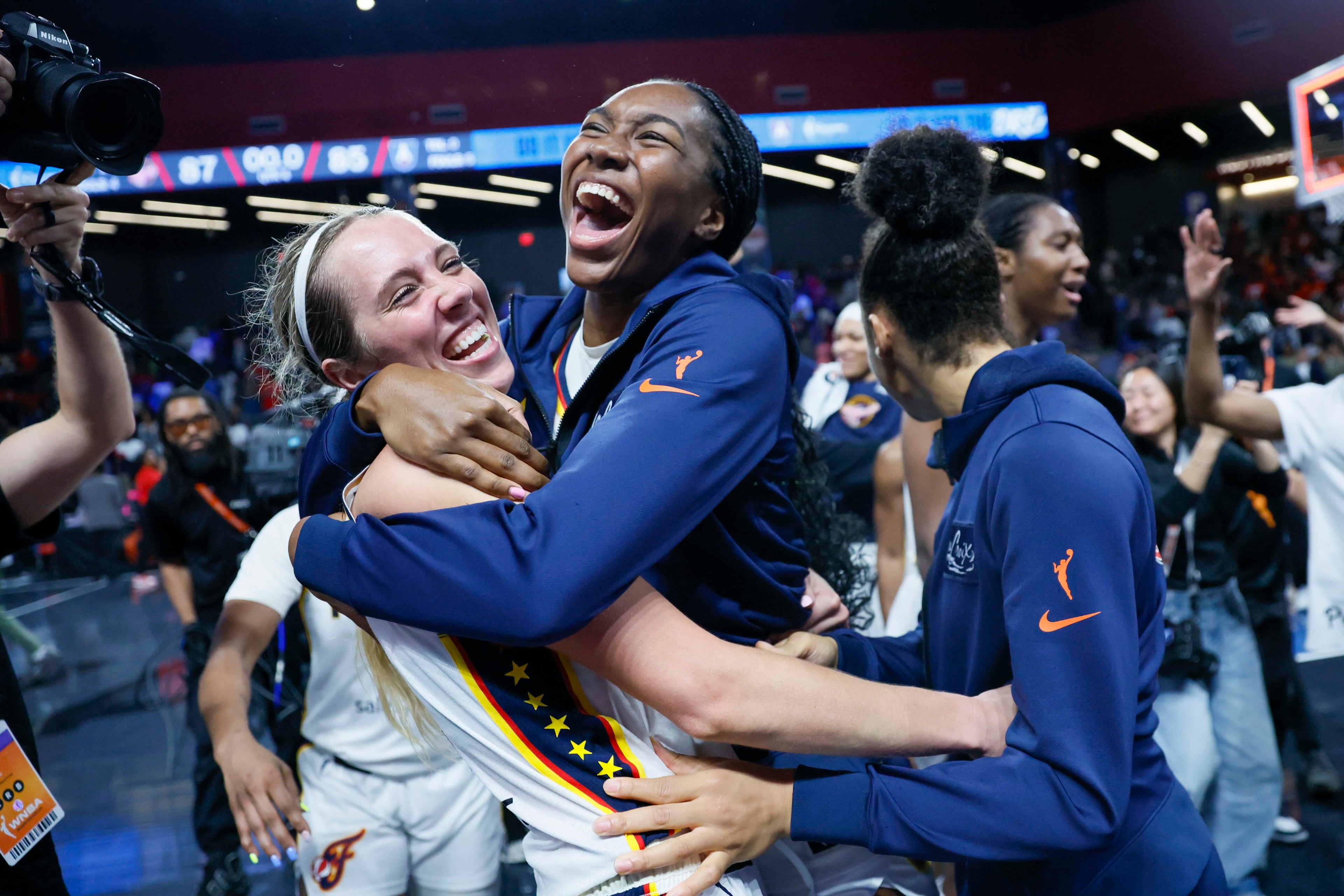 Indiana Fever players celebrate after defeating the Atlanta Dream 87-85 to advance to the next round at Gateway Center Arena on Thursday, Sept. 18, 2024, in Atlanta. (Miguel Martinez/ AJC)