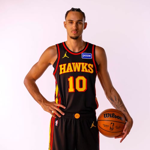 Hawks forward Zaccharie Risacher — pictured posing during media day last month — sat out along with most of Atlanta's regulars in Monday's 119-118 win over the Heat. In Atlanta's previous game agains the Grizzlies, Risacher scored 16 points. (Miguel Martinez/AJC)