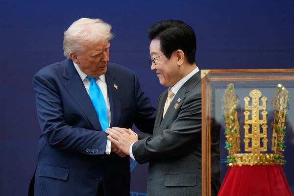 President Donald Trump (left) greeted President Lee Jae Myung of South Korea at an event today at the Gyeongju National Museum. (Mark Schiefelbein/AP)