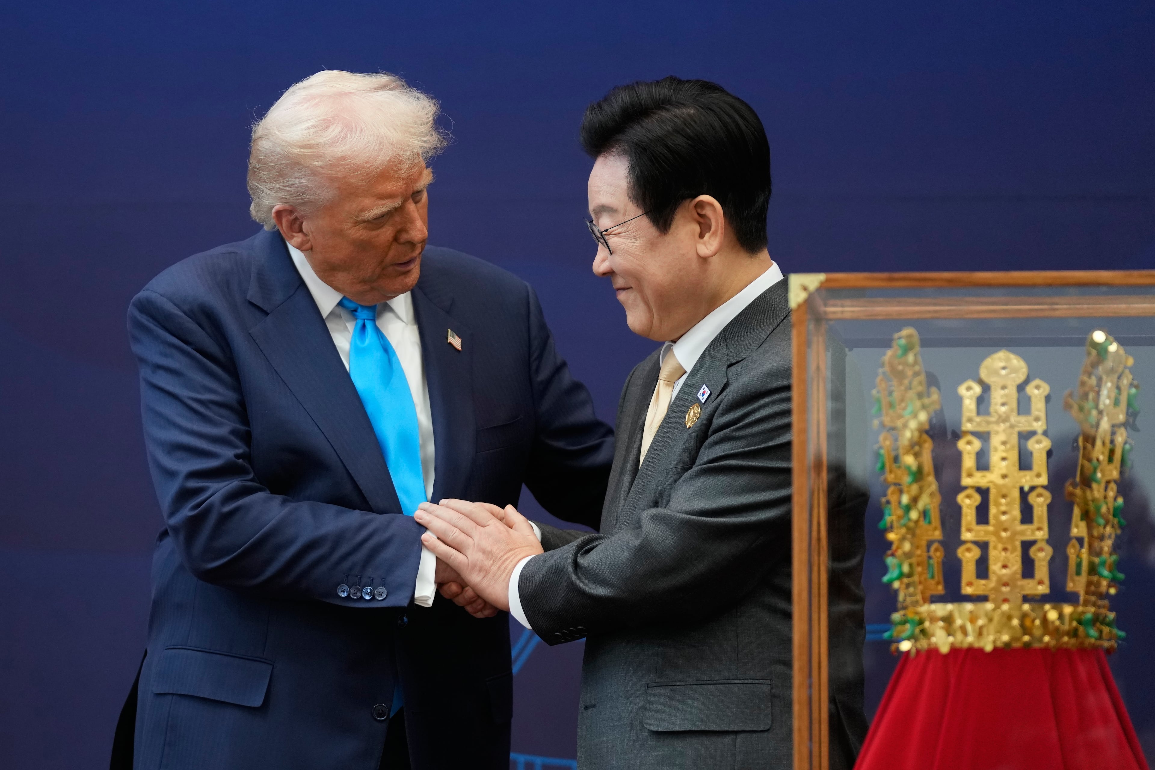 President Donald Trump (left) greeted President Lee Jae Myung of South Korea at an event today at the Gyeongju National Museum. (Mark Schiefelbein/AP)