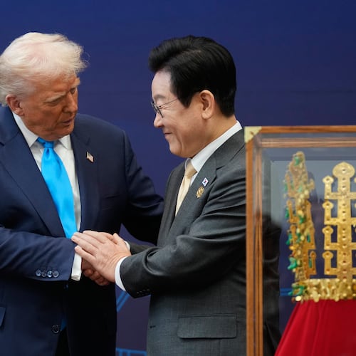 President Donald Trump shakes hands with South Korean President Lee Jae Myung as they attend a high honor ceremony at the Gyeongju National Museum in Gyoeongju, South Korea, Wednesday, Oct. 29, 2025. (AP Photo/Mark Schiefelbein)
