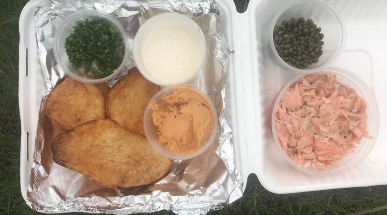 Salmon Chips have been a staple on the menu since the restaurant opened in 2004. This snacky assembly of smoked salmon, chipotle cream cheese, capers, red onions to pile on super-sized potato chips travels well. If paired with a drink, it’ll feel like happy hour. Ligaya Figueras / ligaya.figueras@ajc.com