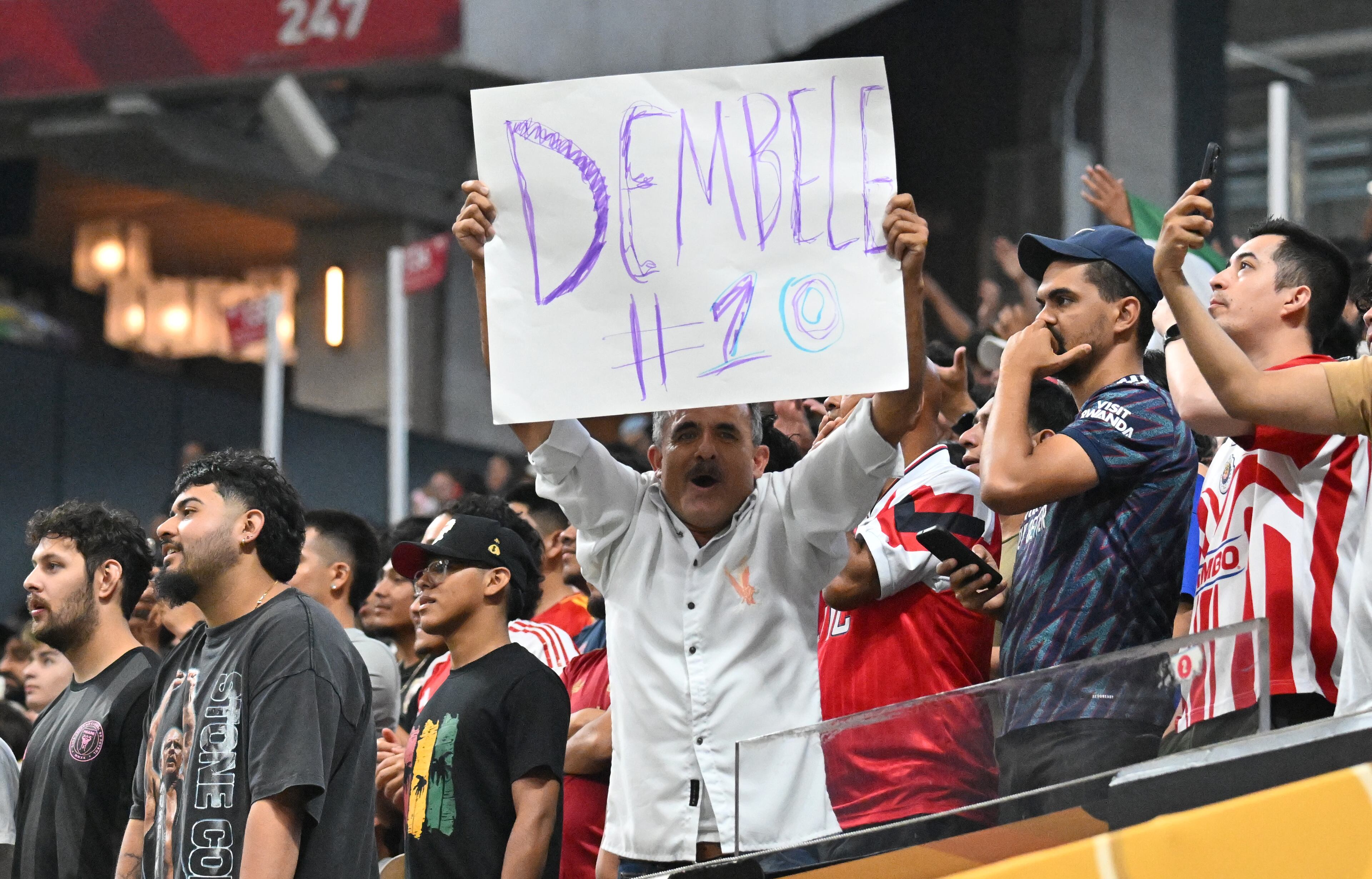Paris Saint-Germain’s fan holds a sign during the second half in Club World Cup quarterfinals match at Mercedes-Benz Stadium, Saturday, July 5, 2025, in Atlanta. Paris Saint-Germain won 2-0 over Bayern Munich. (Hyosub Shin / AJC)