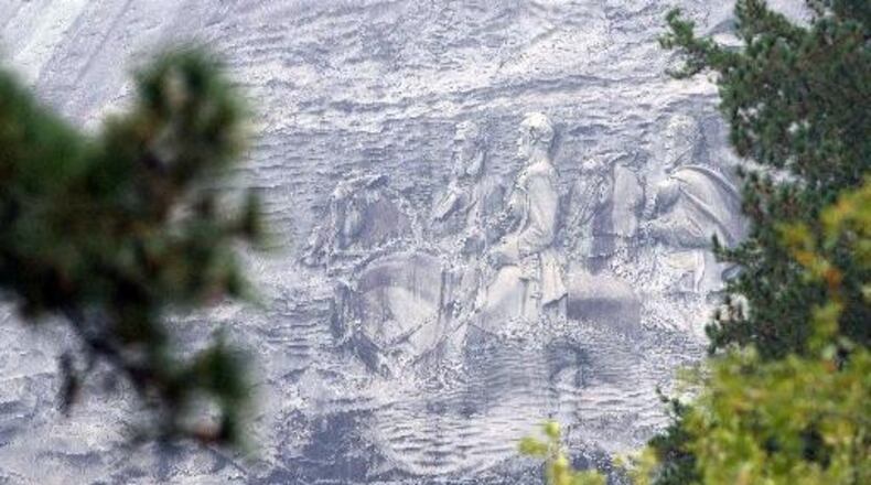 Despite its past and Confederate legacy, Stone Mountain remains a popular site for African-American family reunions and where members of the community go to relax and exercise. KENT D. JOHNSON/KDJOHNSON@AJC.COM