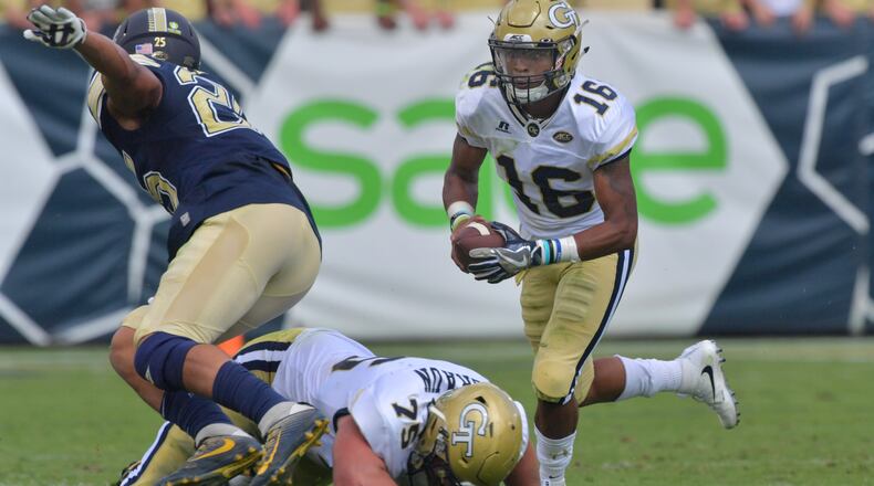 September 23, 2017 Atlanta - With help from guard Parker Braun (75), Georgia Tech quarterback TaQuon Marshall (16) runs for a first down in the first half of an NCAA college football game at Bobby Dodd Stadium on Saturday, September 23, 2017. Georgia Tech won 35 - 17 over the Pittsburgh. HYOSUB SHIN / HSHIN@AJC.COM