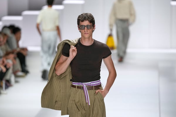 A model wears a creation as part of the men's Dolce & Gabbana Spring-Summer 2026 collection, that was presented in Milan, Italy, Saturday, June 21, 2025. (AP Photo/Luca Bruno)