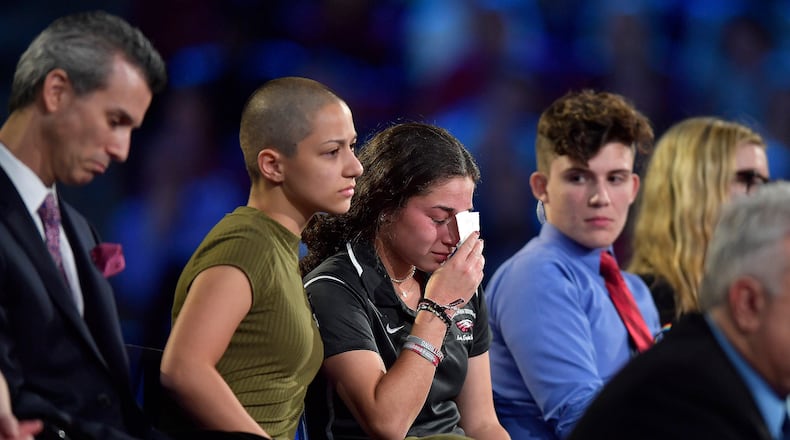 Marjory Stoneman Douglas High School student Emma Gonzalez comforts a classmate during a CNN town hall meeting, Wednesday at the BB&T Center, in Sunrise. (Michael Laughlin/South Florida Sun-Sentinel via AP)