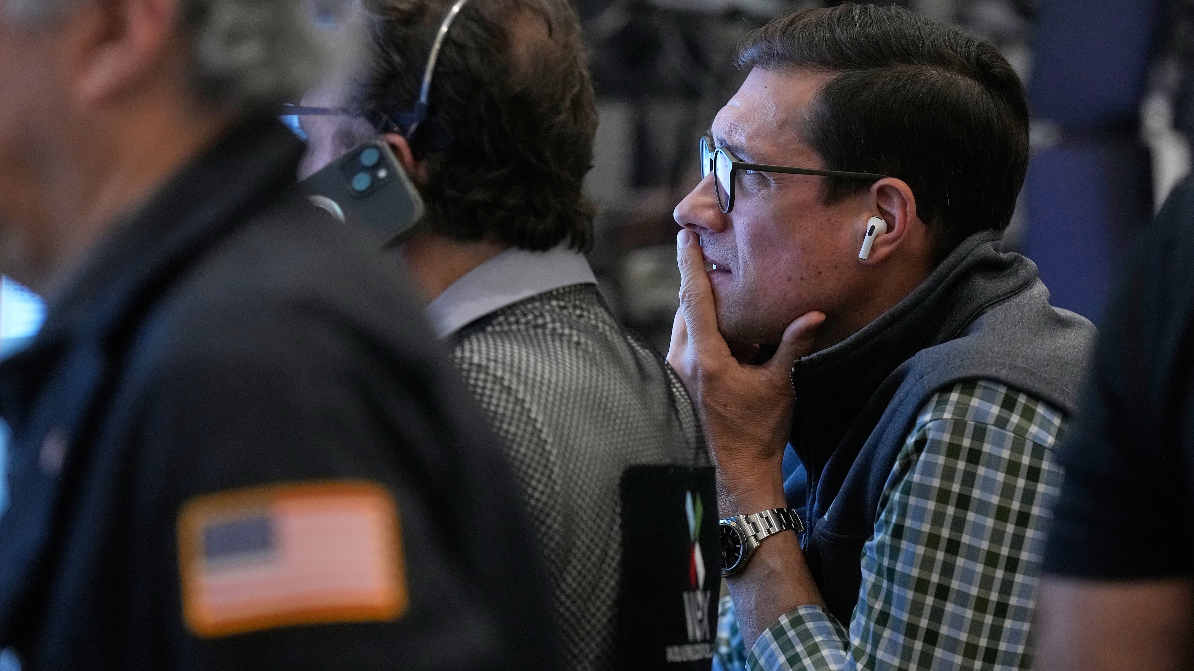 Options trader Rob Pilles, right, works on the floor of the New York Stock Exchange, Monday, Oct. 27, 2025. (AP Photo/Richard Drew)
