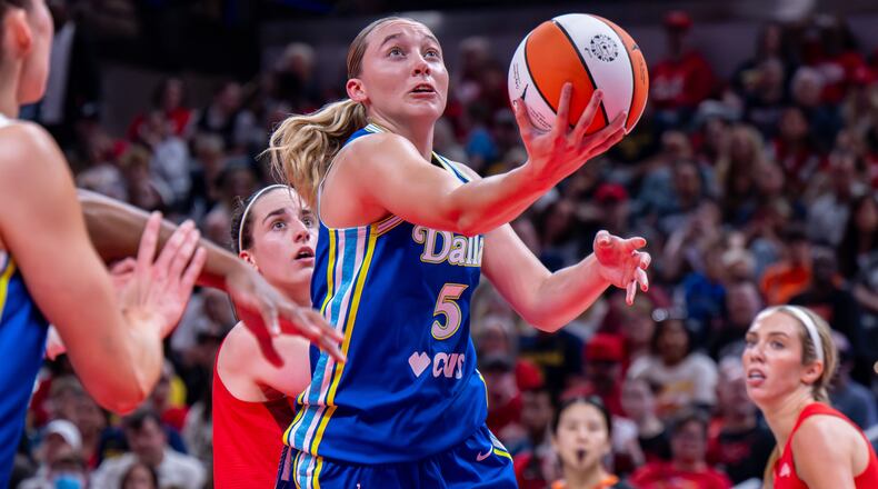Dallas Wings guard Paige Bueckers (5) looks to shoot during the first half of an WNBA basketball game against the Indiana Fever in Indianapolis, Saturday, May 9, 2026. (AP Photo/Doug McSchooler)