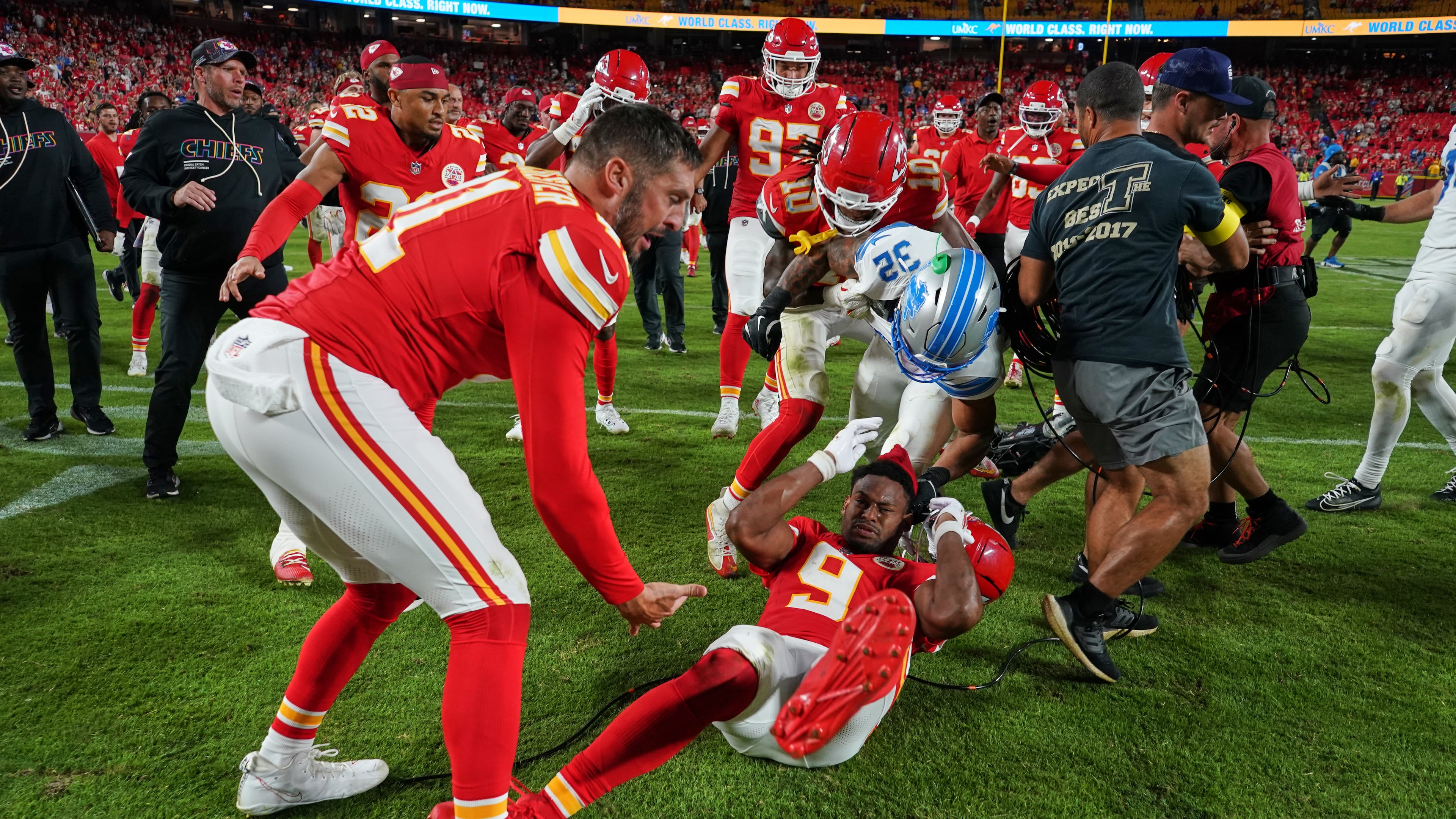 Detroit Lions defensive back Brian Branch (32) fights with Kansas City Chiefs wide receiver JuJu Smith-Schuster (9) while be held back by Chiefs' James Winchester, left, and Isiah Pacheco (10) following an NFL football game Sunday, Oct. 12, 2025, in Kansas City, Mo. (AP Photo/Ed Zurga)