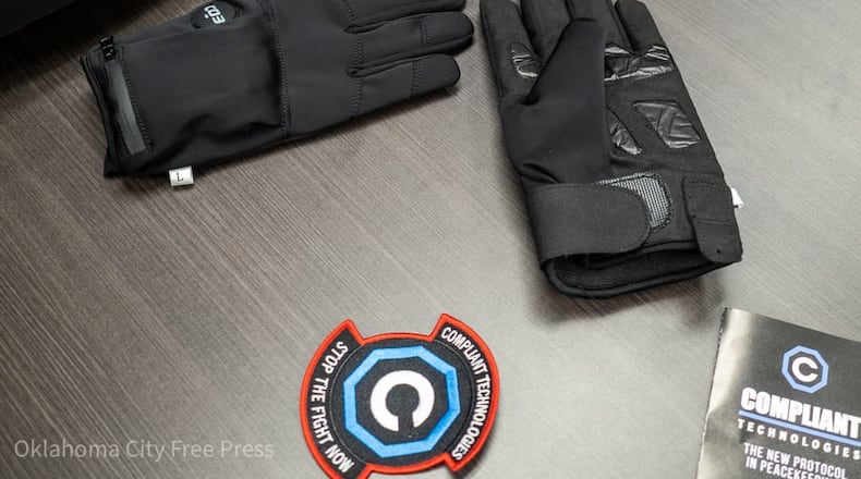 The G.L.O.V.E., developed by Compliant Technologies LLC, sits on a table after a demonstration at the Oklahoma County Detention Center in Oklahoma City, March 22, 2023. (Brett Dickerson/Oklahoma City Free Press via AP)