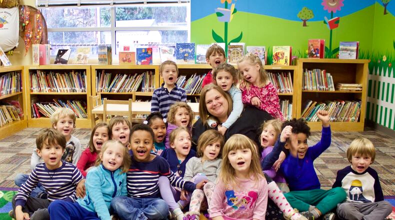 Sarah Garland, now permanent director of the College Heights Early Childhood Learning Center, with her pre-K students. Courtesy City Schools Decatur