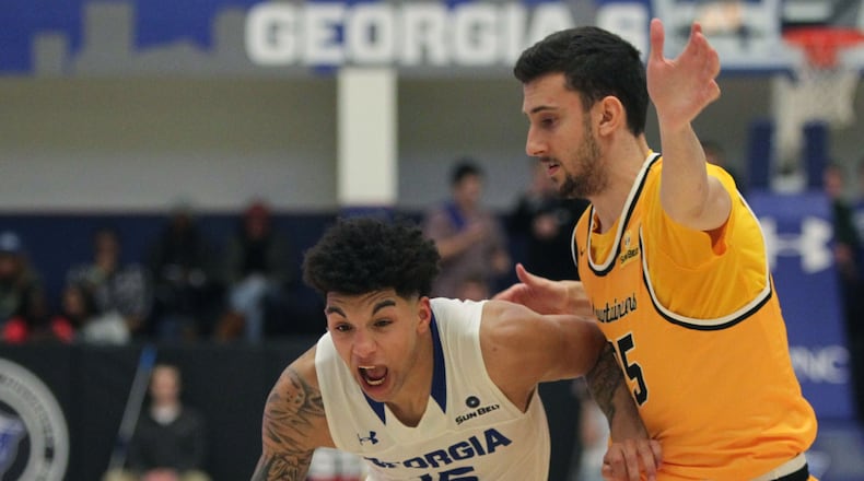 GSU guard D'Marcus Simonds (15) dashes past ASU guard Jake Babic (25) in a Sun Belt Conference college basketball game between Georgia State University and Appalachian State University in Atlanta, Georgia, on Monday, January 23, 2017. (HENRY TAYLOR / AJC file)