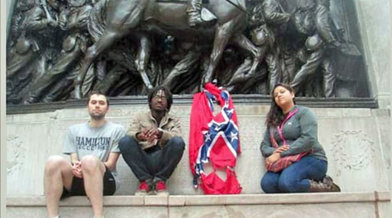 Stephen Allsop (second from left) says he and fellow protesters intended to make a statement by burning Confederate flags near a statue honoring black soldiers in the Union Army.
