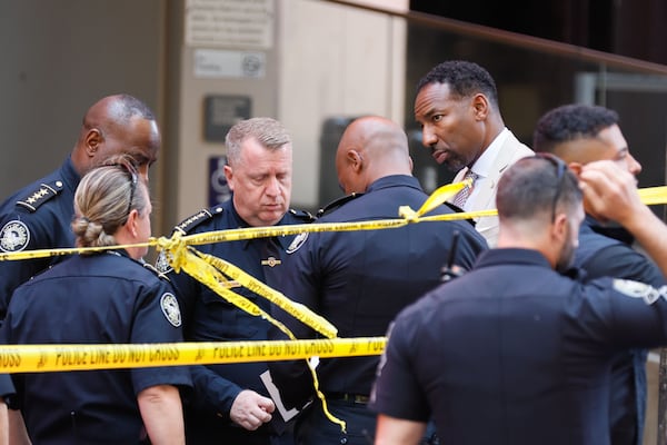 Atlanta Mayor Andre Dickens and Atlanta Police Chief Darin Schierbaum are seen at the scene where four people were injured during a shooting at Peachtree Center on Tuesday, June 11, 2024. (Miguel Martinez/AJC)