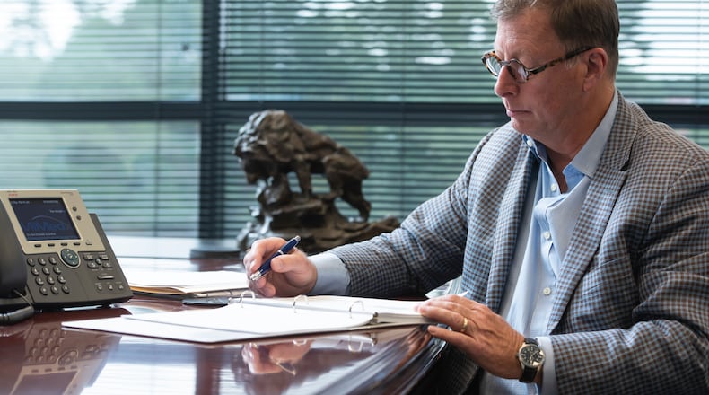 MiMedx CEO Tim Wright works at the company's Marietta headquarters. Wright is pushing the company to develop a potential 'blockbuster' drug for osteoarthritis.