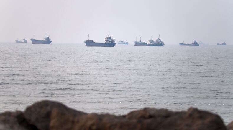 Commercial vessels are seen in the Strait of Hormuz off Bandar Abbas, Iran, Tuesday, June 30, 2026. (Amirhosein Khorgooi/ISNA via AP)