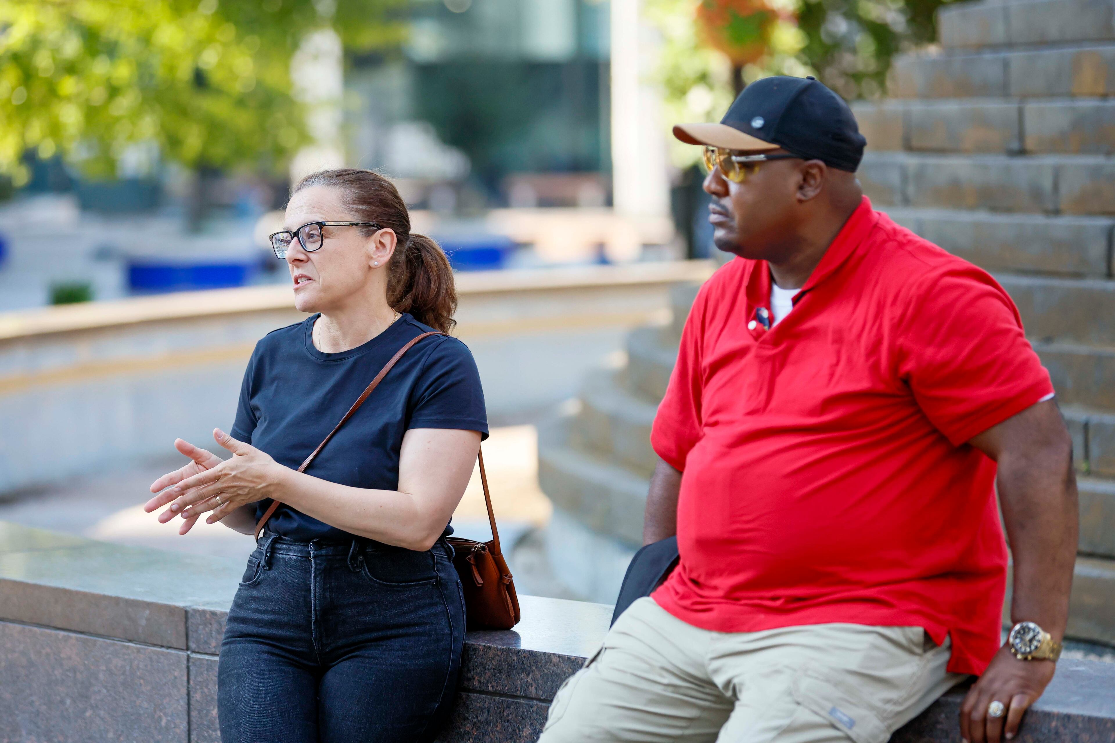Cathryn Vassell (left), chief executive officer of Partners for Home, and Richard DeShields visit Woodruff Park, where DeShields surveyed people experiencing homelessness on Monday, July 7, 2025. (Miguel Martinez/AJC)