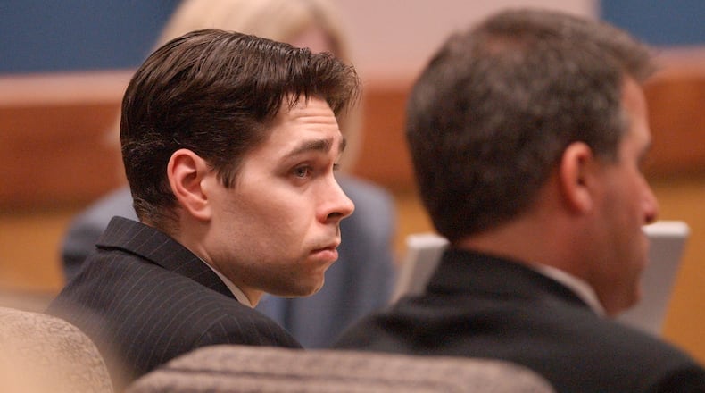 In this 2005 file photo, Michael LeJeune, left, listens to witnesses in Fulton County Superior Court during his death penalty trial. BITA HONARVAR / BHONARVAR@AJC.COM