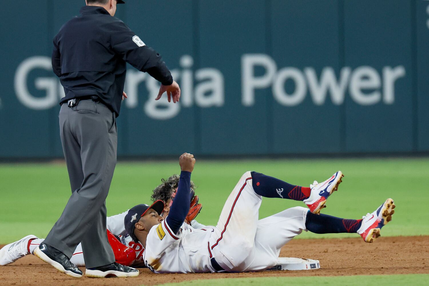 Philadelphia Phillies’ Cristian Pache (19) safely steals second base against Atlanta Braves second baseman Ozzie Albies during the fifth inning of NLDS Game 2 in Atlanta on Monday, Oct. 9, 2023.   (Miguel Martinez / Miguel.Martinezjimenez@ajc.com)