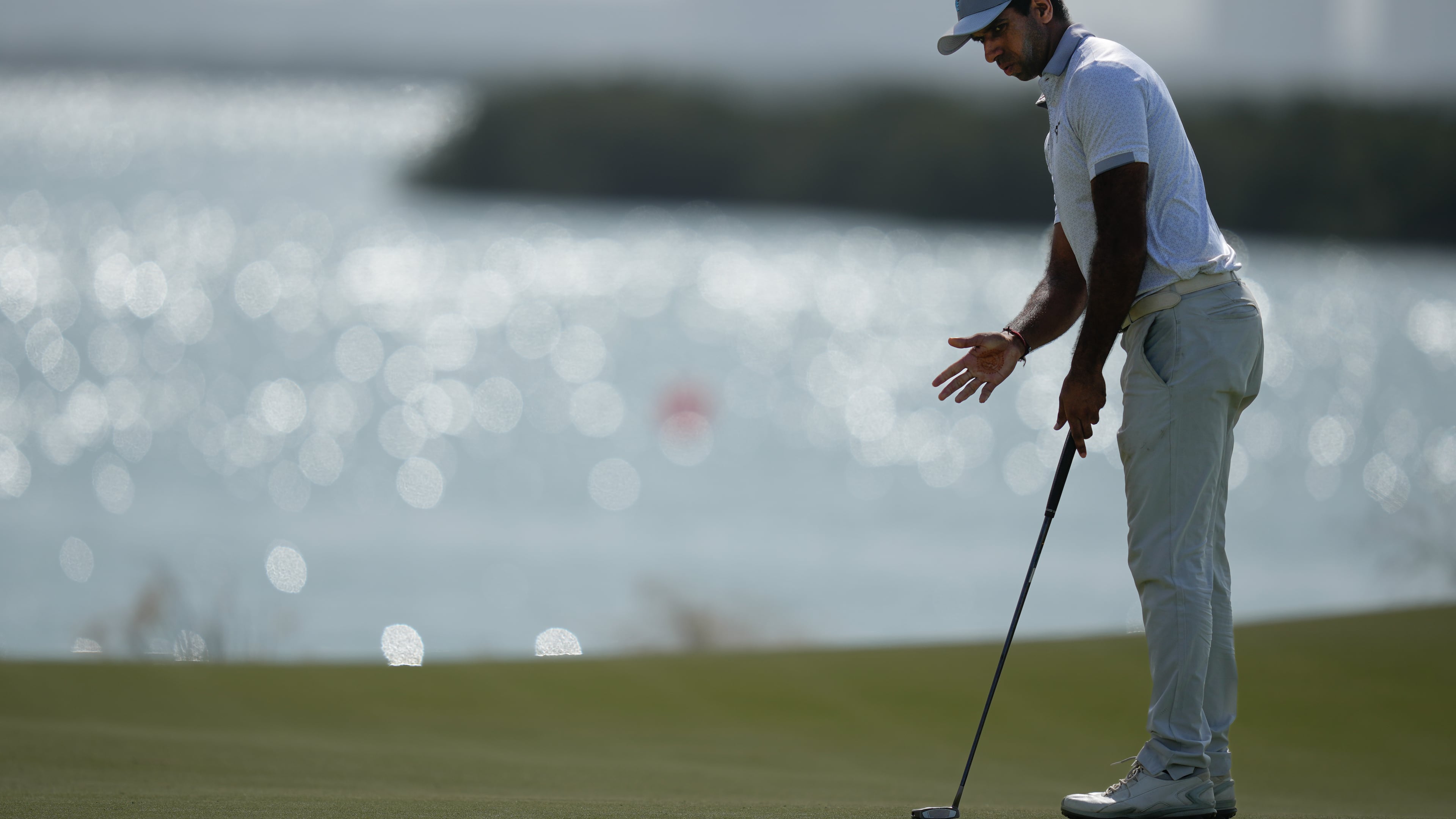 Aaron Rai of England reacts after missing a putt on the 8th hole during the final round of the Abu Dhabi Golf Championship in Abu Dhabi, United Arab Emirates, Sunday, Nov. 9, 2025. (AP Photo/Altaf Qadri)
