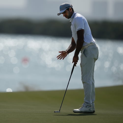 Aaron Rai of England reacts after missing a putt on the 8th hole during the final round of the Abu Dhabi Golf Championship in Abu Dhabi, United Arab Emirates, Sunday, Nov. 9, 2025. (AP Photo/Altaf Qadri)